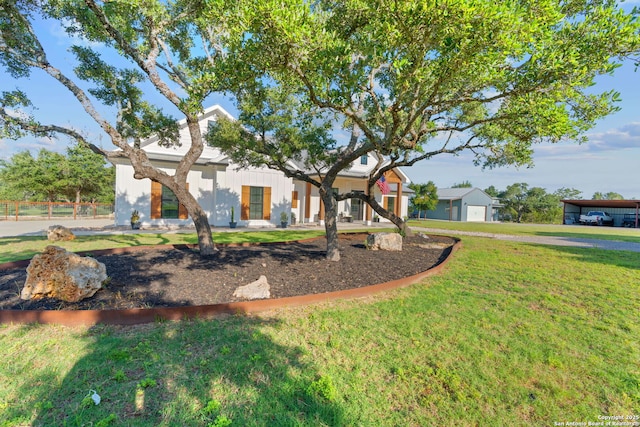 view of front of property featuring a front yard and board and batten siding