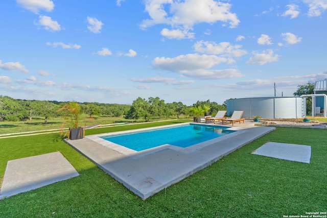 outdoor pool with a yard