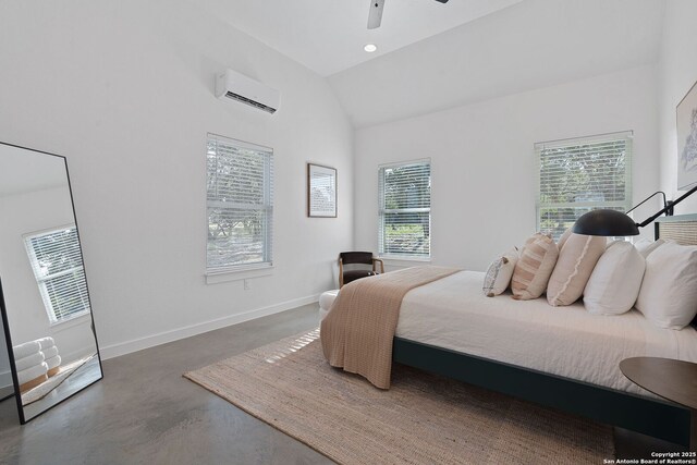 bedroom with baseboards, an AC wall unit, concrete flooring, lofted ceiling, and recessed lighting