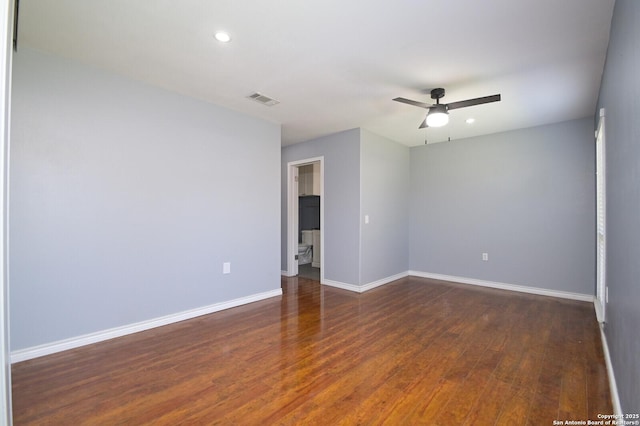 empty room featuring visible vents, baseboards, recessed lighting, wood finished floors, and a ceiling fan