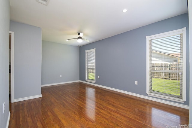 spare room with wood finished floors, visible vents, baseboards, recessed lighting, and ceiling fan