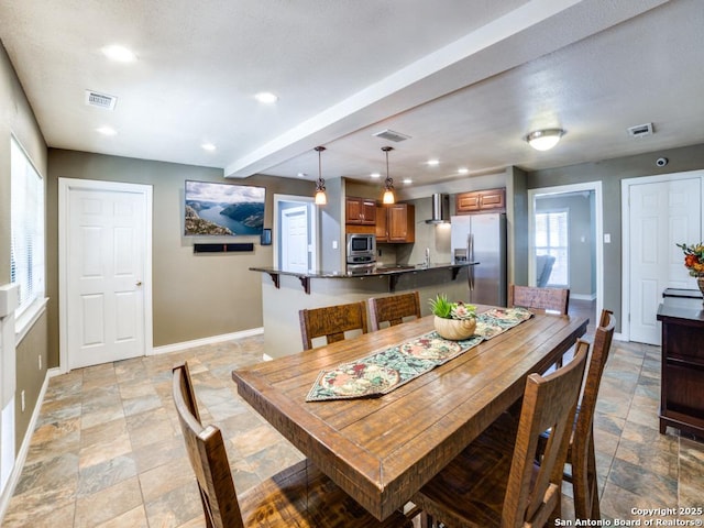 dining room with recessed lighting, visible vents, and baseboards