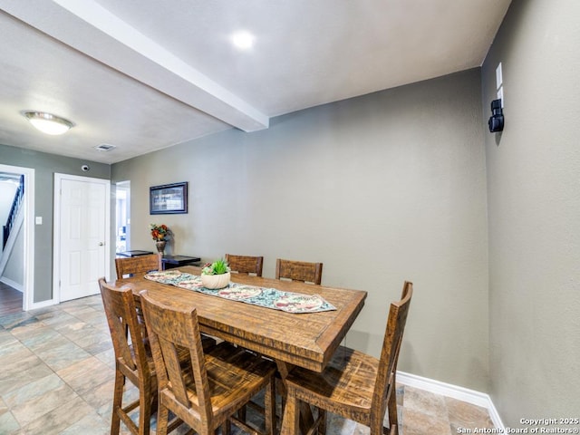 dining space featuring visible vents and baseboards