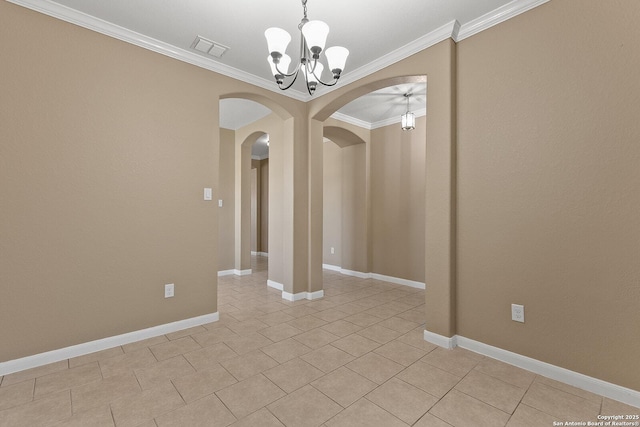 unfurnished room with visible vents, crown molding, baseboards, an inviting chandelier, and arched walkways