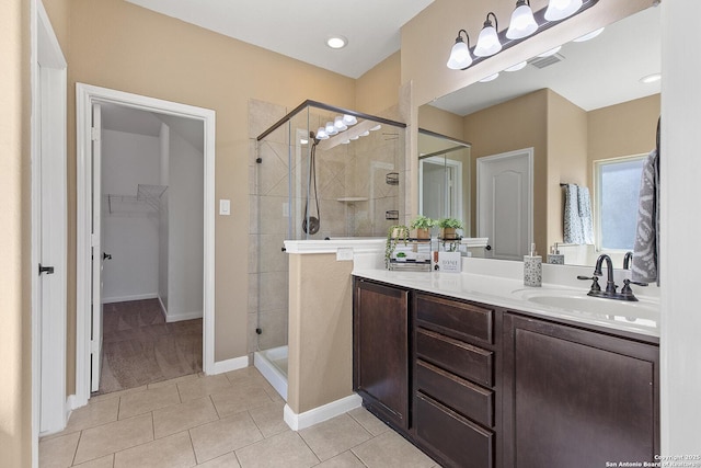 full bathroom with tile patterned flooring, visible vents, vanity, and a stall shower