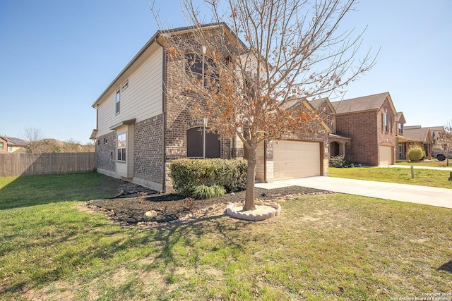 view of front facade featuring brick siding, fence, concrete driveway, a front yard, and a garage