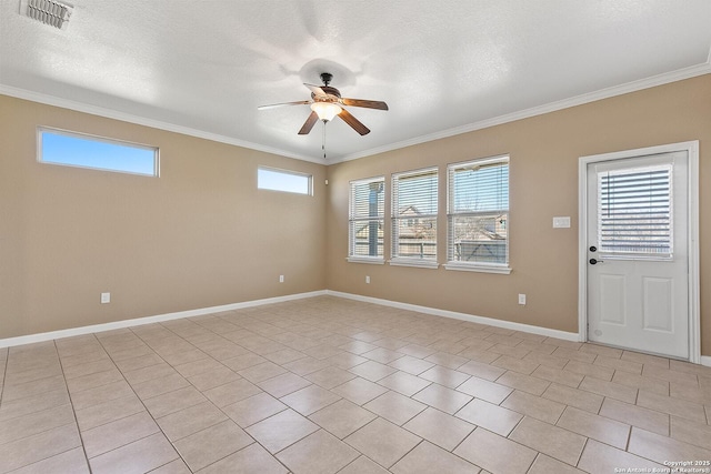 interior space with visible vents, ornamental molding, a ceiling fan, a textured ceiling, and baseboards