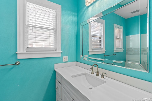 bathroom with vanity and visible vents