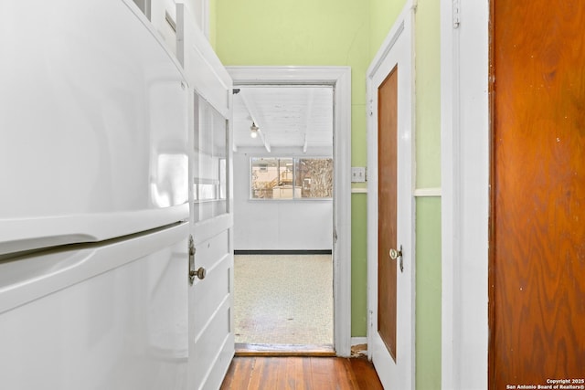 corridor featuring wood finished floors