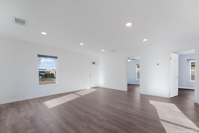 unfurnished living room with dark wood finished floors, recessed lighting, visible vents, and a ceiling fan