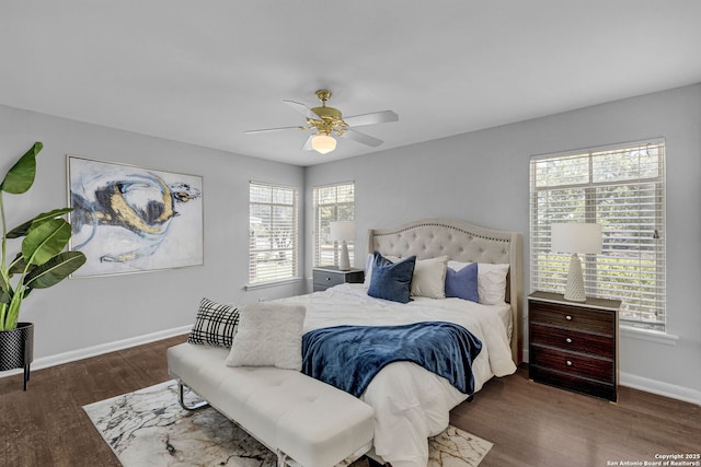 bedroom featuring a ceiling fan, wood finished floors, and baseboards