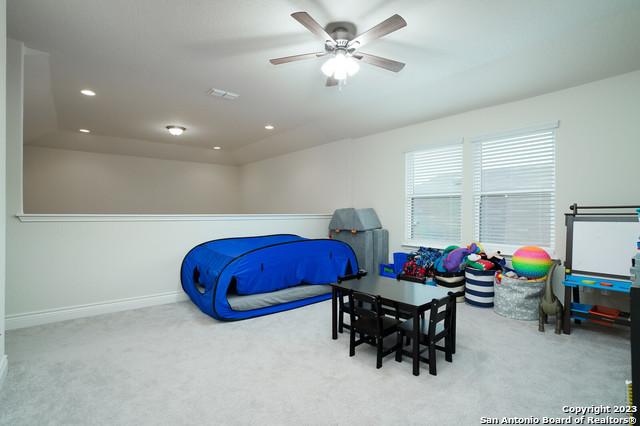 carpeted bedroom featuring visible vents, recessed lighting, baseboards, and ceiling fan