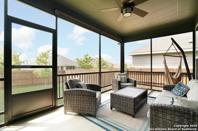 sunroom / solarium with ceiling fan