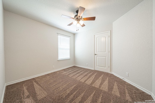 unfurnished room with baseboards, ceiling fan, a textured ceiling, carpet flooring, and a textured wall