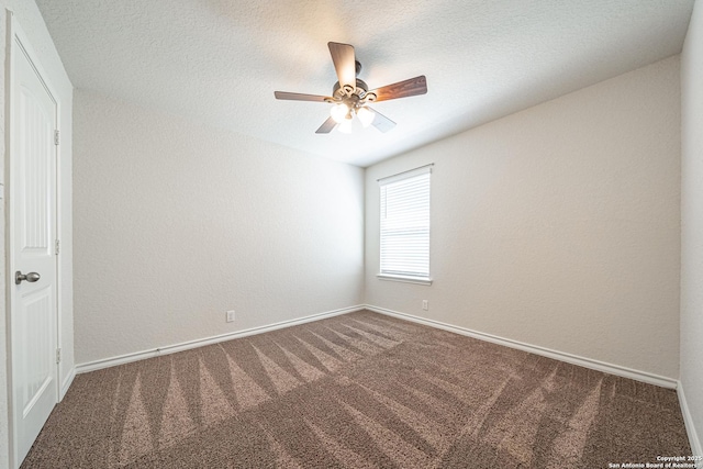 carpeted spare room with a ceiling fan, baseboards, and a textured ceiling