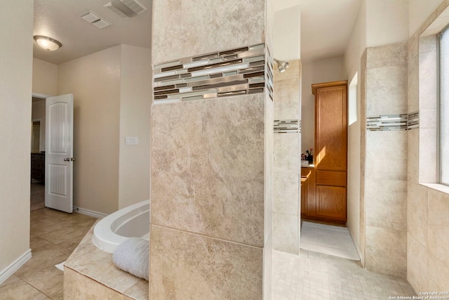 full bath with tile patterned floors, visible vents, a garden tub, and a walk in shower