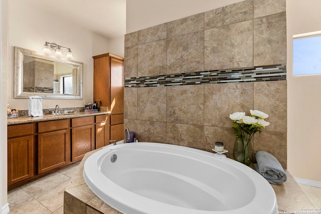 bathroom featuring vanity, a garden tub, and tile patterned flooring