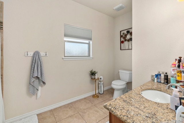 bathroom featuring visible vents, toilet, tile patterned flooring, baseboards, and vanity