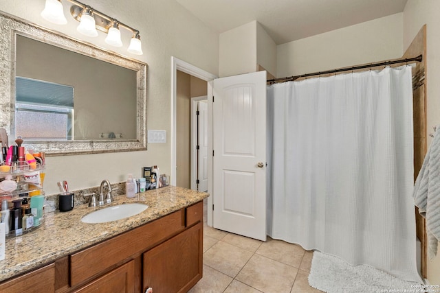 full bath with tile patterned floors, vanity, and a shower with shower curtain