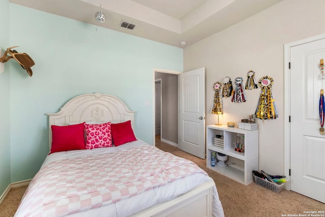 bedroom featuring carpet flooring and visible vents