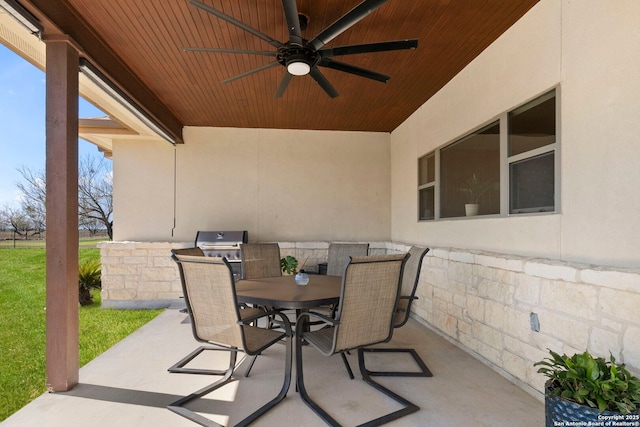 view of patio / terrace featuring outdoor dining space and a ceiling fan