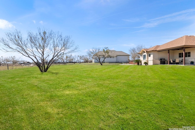 view of yard with a patio and fence