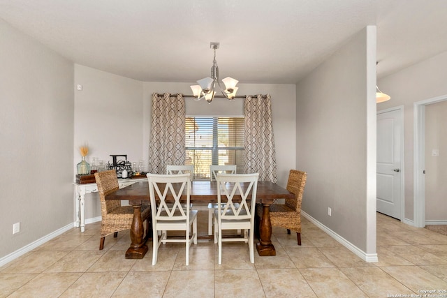 dining space featuring an inviting chandelier, light tile patterned floors, and baseboards