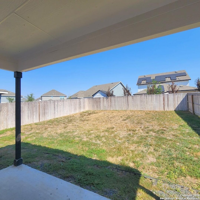 view of yard with a fenced backyard and a patio area