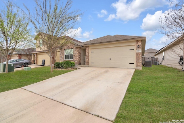 single story home featuring brick siding, central AC unit, concrete driveway, and a front yard