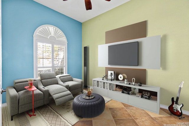 tiled living room with baseboards and ceiling fan