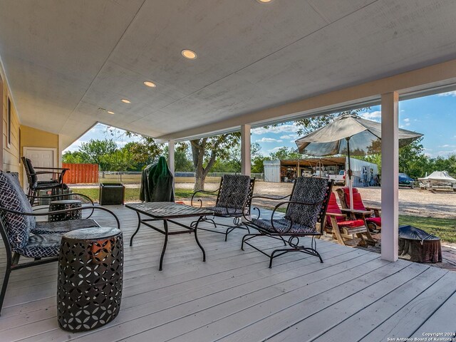 wooden terrace featuring fence