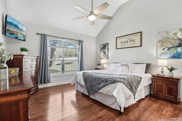 bedroom featuring ceiling fan, baseboards, dark wood-type flooring, and lofted ceiling