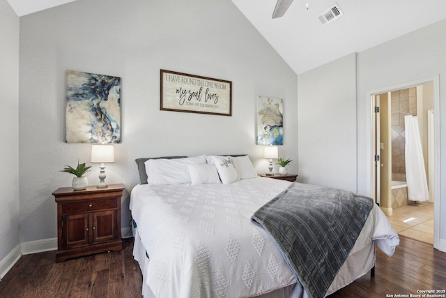 bedroom featuring visible vents, connected bathroom, ceiling fan, dark wood finished floors, and vaulted ceiling