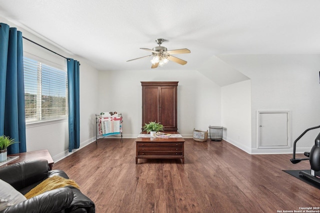 sitting room with a ceiling fan, wood finished floors, and baseboards