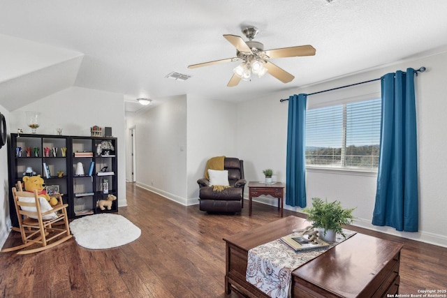 living room with baseboards, wood finished floors, visible vents, and ceiling fan