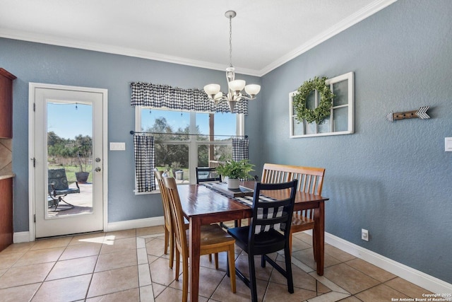 dining room with a notable chandelier, light tile patterned flooring, baseboards, and ornamental molding