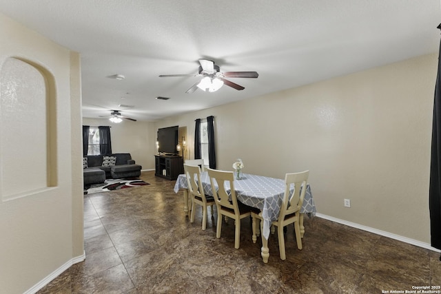 dining space with visible vents, ceiling fan, and baseboards