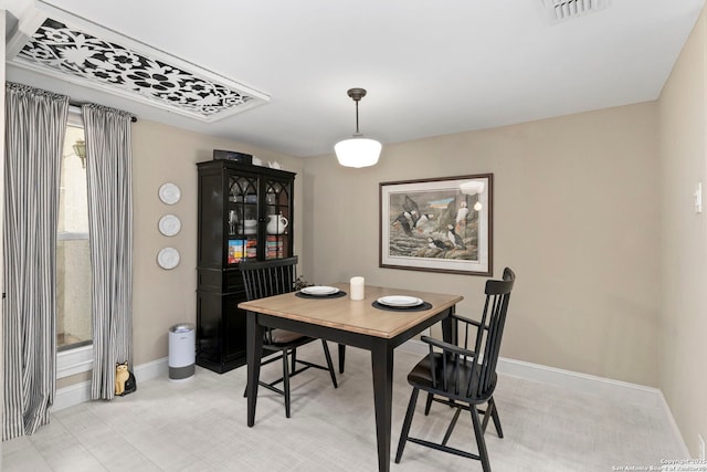 dining room with visible vents and baseboards