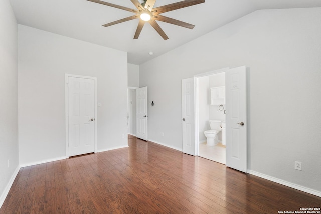 unfurnished bedroom featuring connected bathroom, high vaulted ceiling, baseboards, and wood finished floors