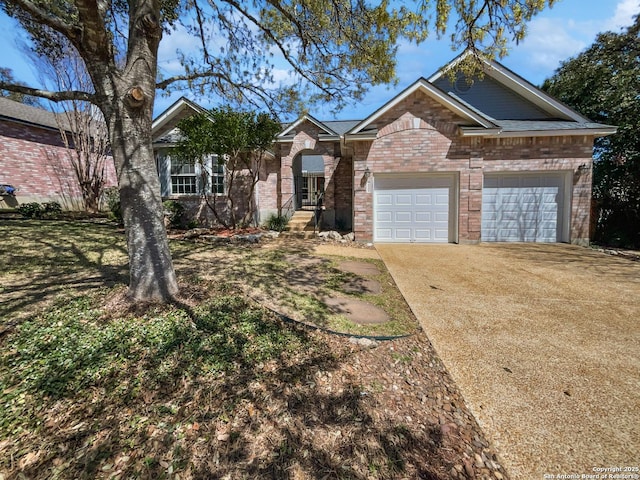 view of front of home with brick siding, an attached garage, and concrete driveway