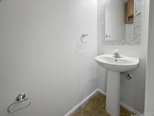 bathroom featuring baseboards