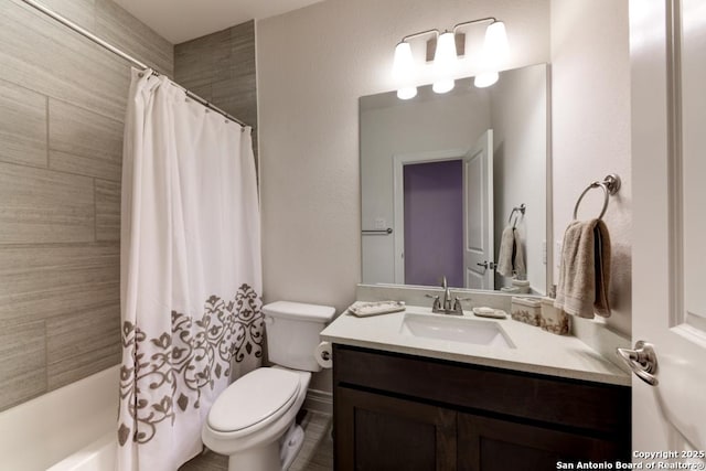 bathroom with toilet, vanity, and shower / bathtub combination with curtain