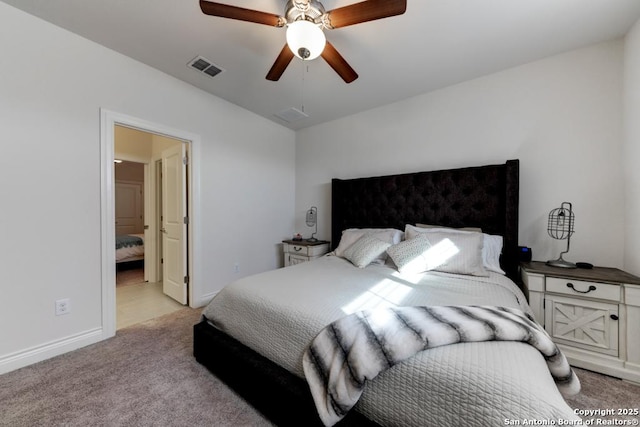 bedroom with visible vents, light colored carpet, baseboards, and a ceiling fan