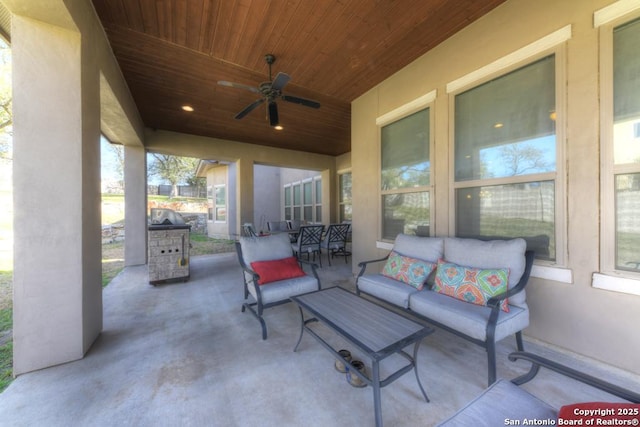 view of patio / terrace with an outdoor living space and a ceiling fan