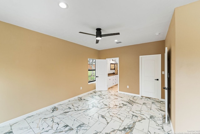 empty room with recessed lighting, baseboards, marble finish floor, and ceiling fan