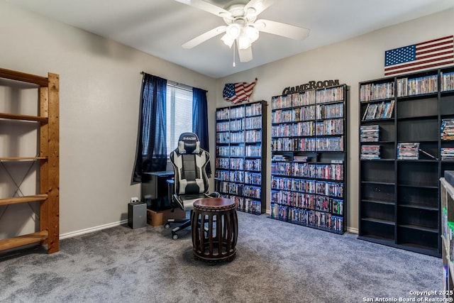 sitting room featuring ceiling fan, baseboards, and carpet floors