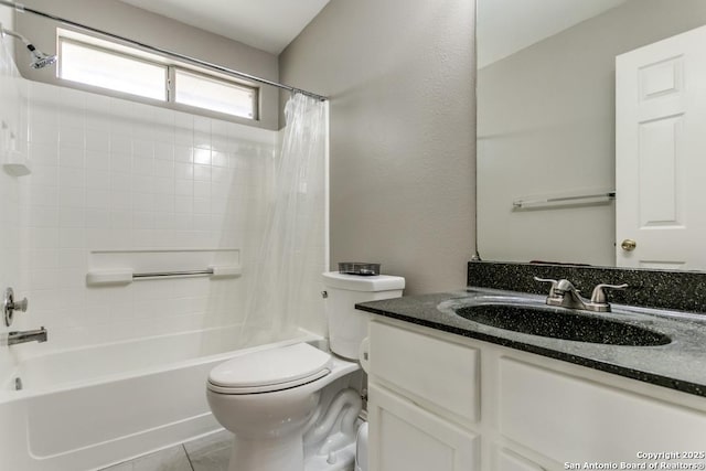 full bathroom featuring vanity, toilet, shower / bath combo with shower curtain, and tile patterned flooring