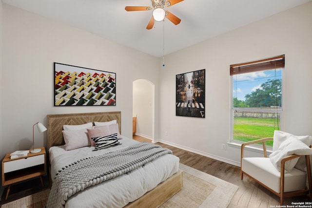 14019 Tahoe Vis, San Antonio, TX 78253 - bedroom with arched walkways, wood finished floors, baseboards, and a ceiling fan