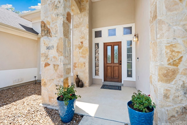 14019 Tahoe Vis, San Antonio, TX 78253 - doorway to property featuring stucco siding, stone siding, and visible vents