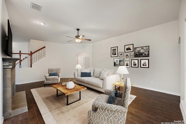 14019 Tahoe Vis, San Antonio, TX 78253 - living room with baseboards, a ceiling fan, visible vents, arched walkways, and hardwood / wood-style flooring